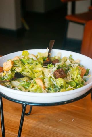 Caesar salad with croutons and shaved cheese