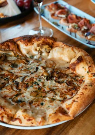 Truffled Wild Mushroom pizza with a browned crust
